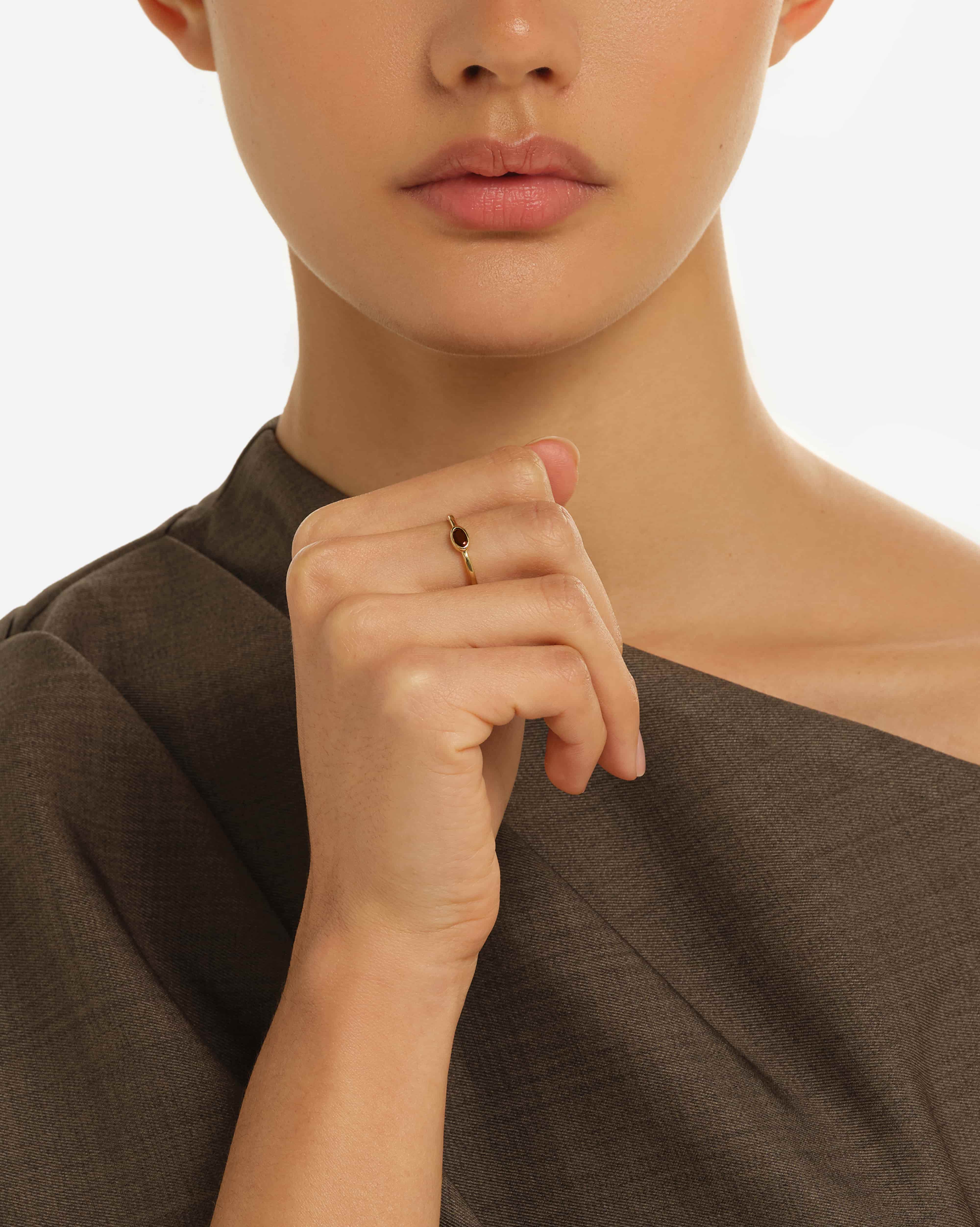 Woman wearing delicate Breno Natural Garnet Ring in 18K Gold Vermeil on hand - Elegant Everyday Jewelry by Handiora